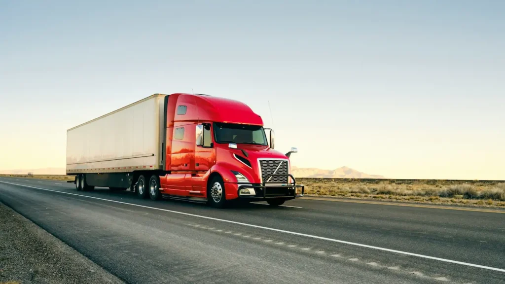 Large Red Semi-trailer Driving